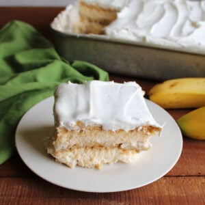 Banana Pudding Icebox Cake 9 Slice of banana icebox cake with layers of graham cracker, banana slices, condensed milk pudding, and whipped topping ready to eat.