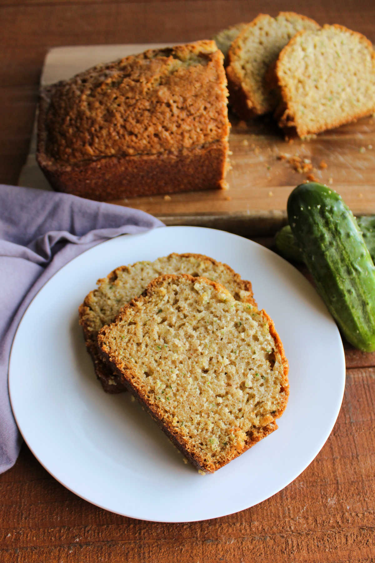 Slices of cucumber bread on plate, ready to eat. 