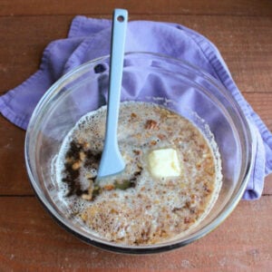 Grandma's Date Nut Bread 13 Butter melting in bowl of hot water with dates.