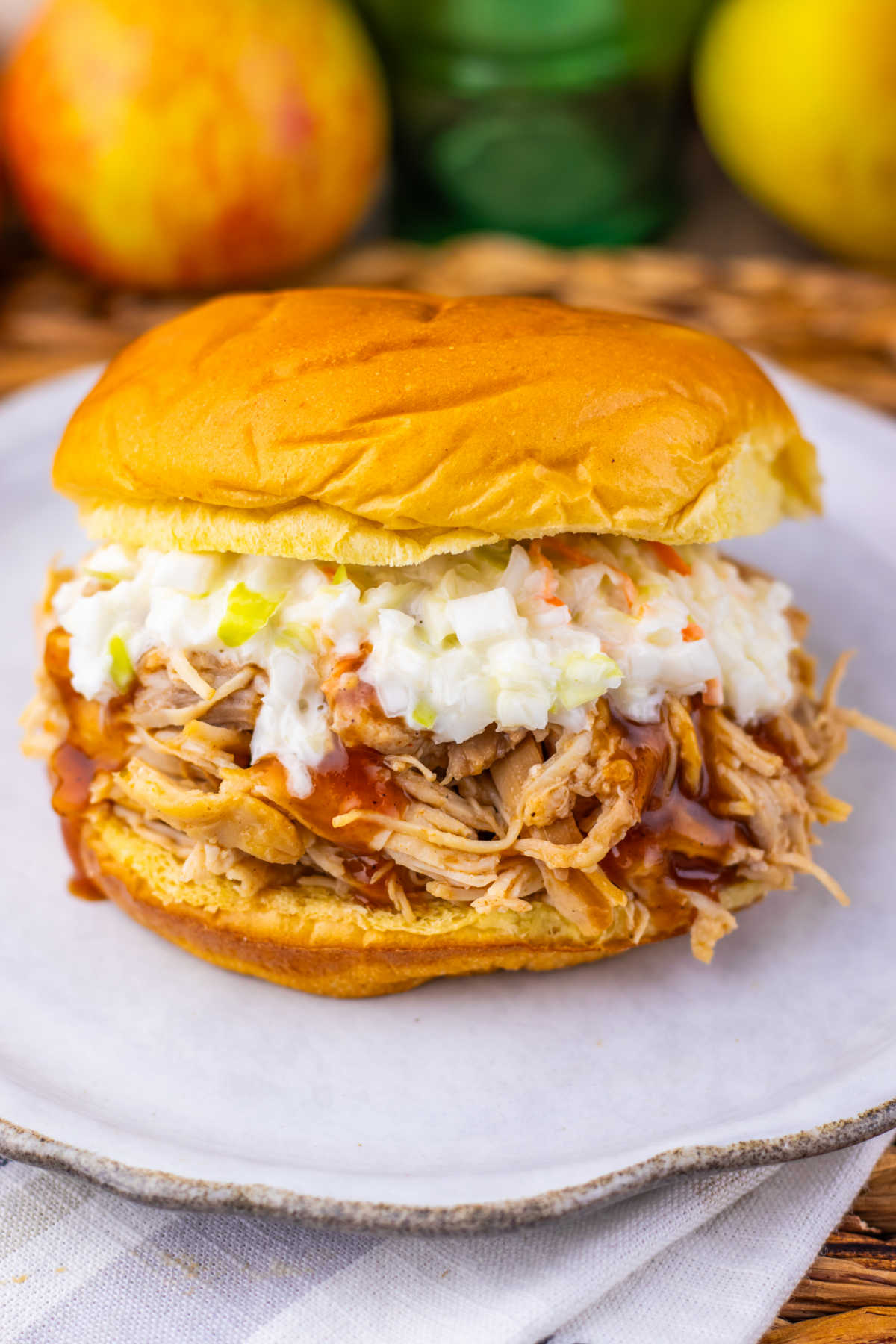 Pulled chicken sandwich with apple cider bbq sauce and slaw, ready to eat. 