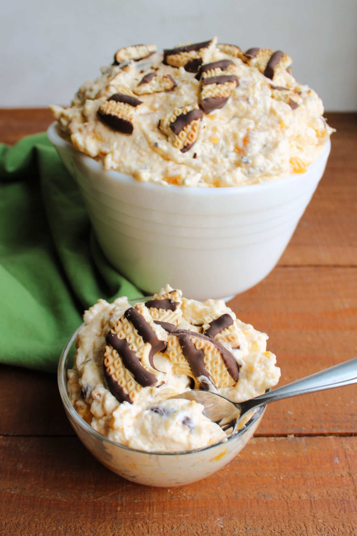 Bite of creamy cookie salad on spoon, ready to eat. 