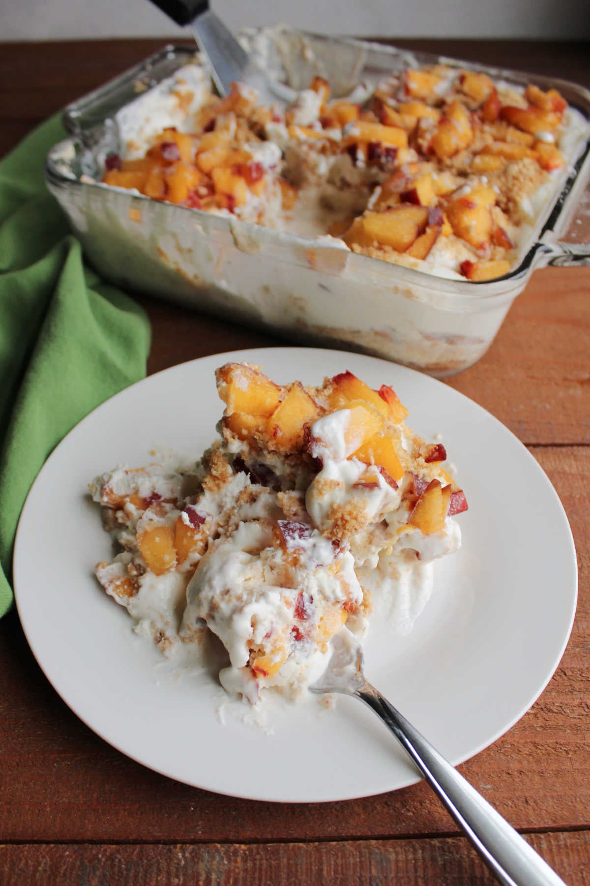 Peaches and Cream Icebox Cake 11 Bite of peaches and cream refrigerator cake on fork, ready to eat.
