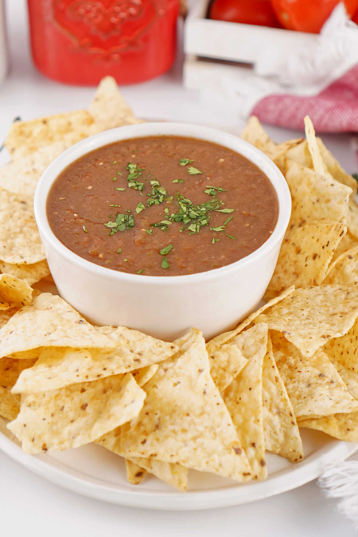 Platter of tortilla chips with a bowl of homemade blender salsa, ready to eat. 