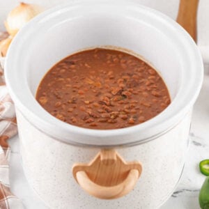 Crockpot Baked Beans With Dried Beans 14 Thickened cooked baked beans in crockpot, ready to serve.
