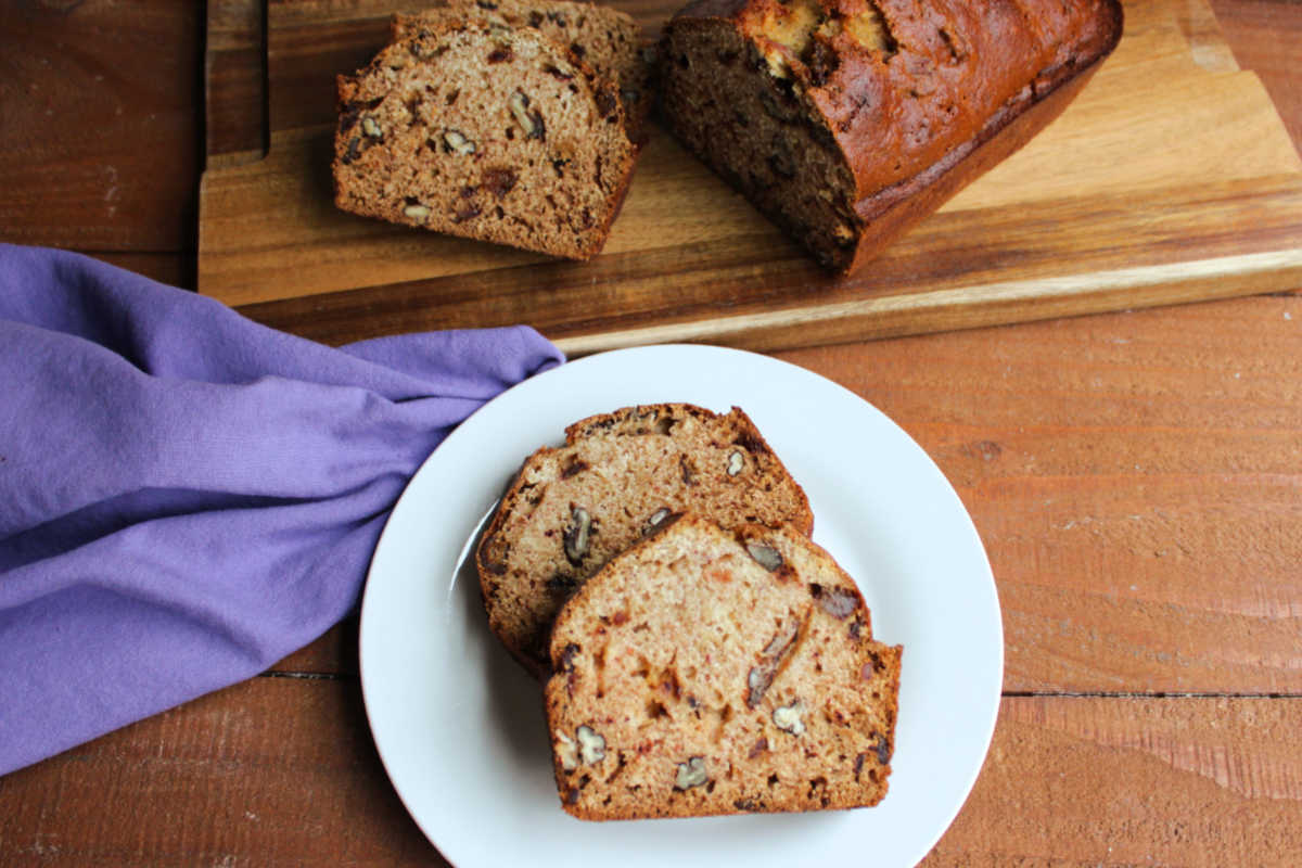 Grandma's Date Nut Bread 7 Slices of homemade date nut loaf on a plate, ready to eat.