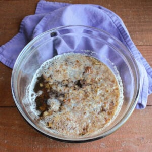 Grandma's Date Nut Bread 12 Mixing bowl with bits of dates soaking in hot water and baking soda mixture.