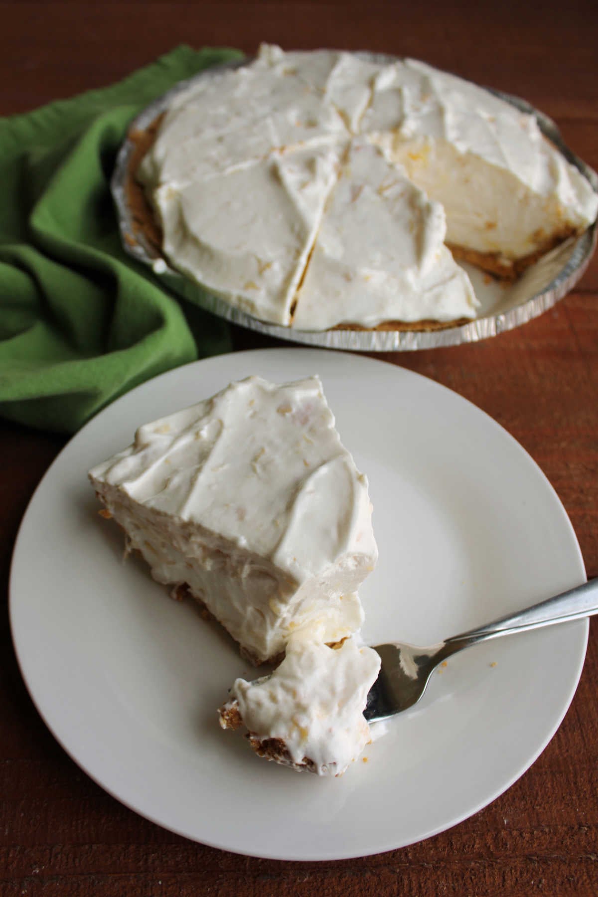 Bite of creamy no bake pineapple pie on fork, ready to eat. 