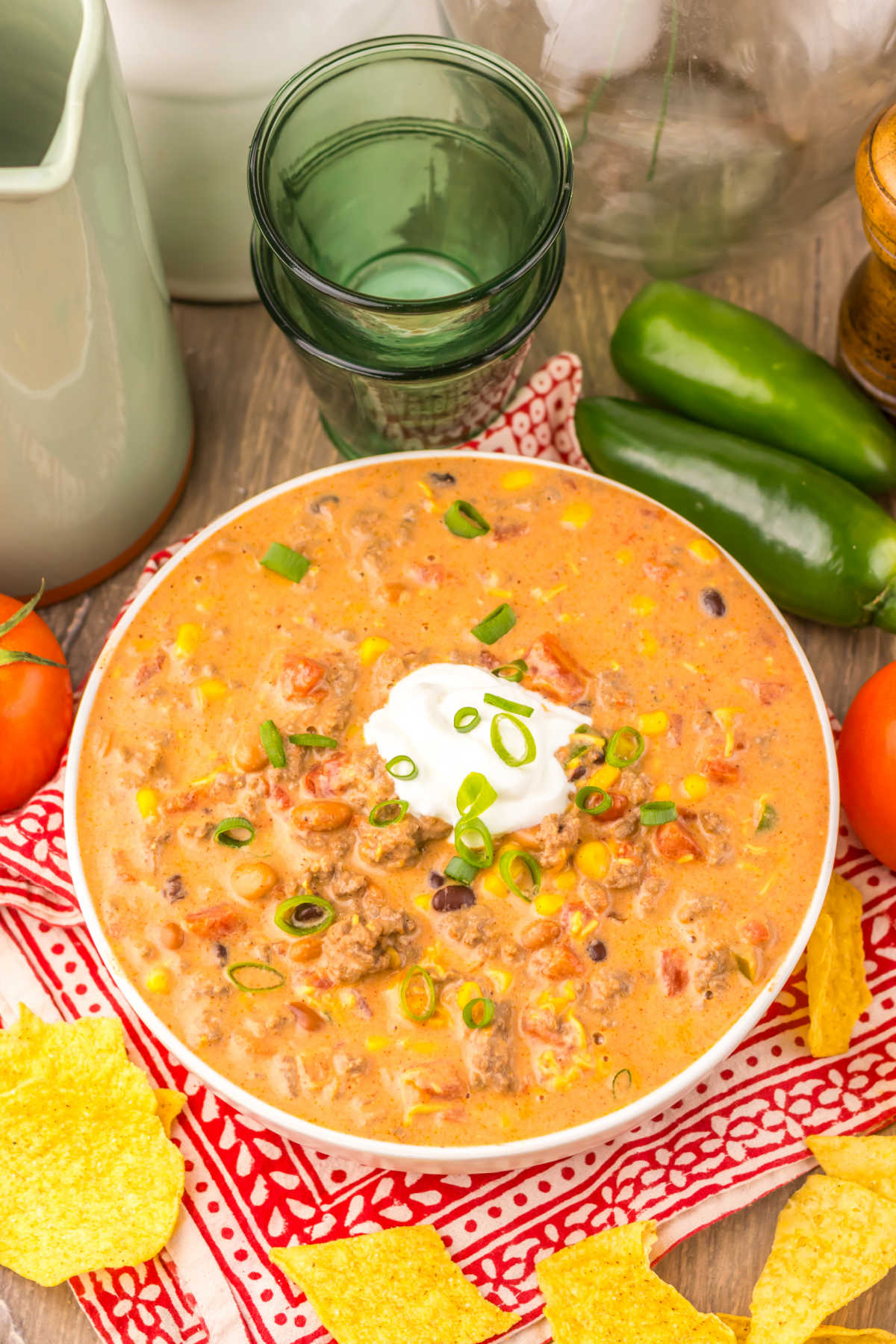Bowl of creamy taco soup with ground beef, beans, and veggies, ready to eat. 