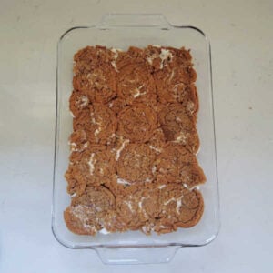 Oatmeal creme pies pressed onto the bottom of a glass baking dish to form a crust.
