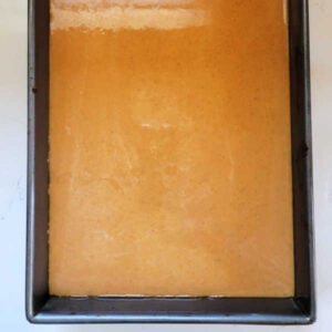 Grandma's Pumpkin Pie Bars 14 Pumpkin pie filling poured over the crust, ready to go in the oven.